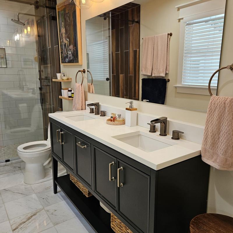 Double sink vanity with modern faucets and storage Double sink vanity with modern faucets and storage