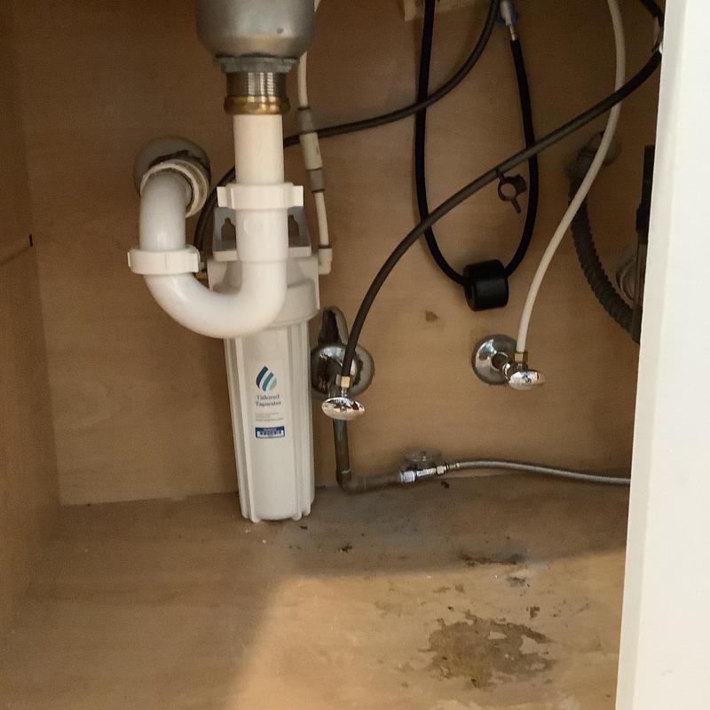 Kitchen sink shut-off valves and plumbing connections under cabinet Kitchen sink shut-off valves and plumbing connections under cabinet