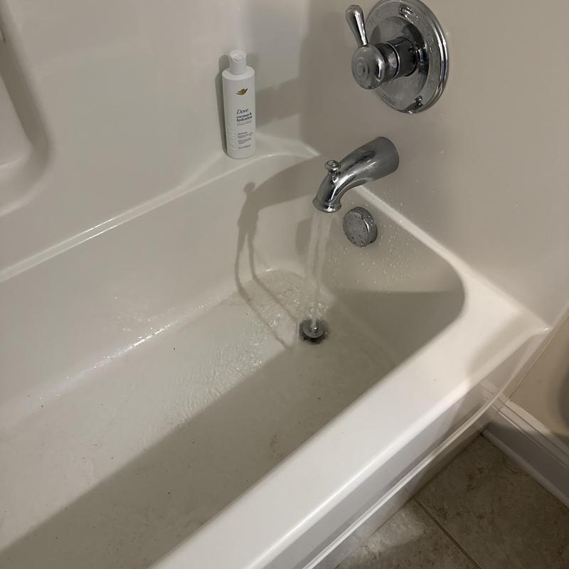 Tub drain with running water in kids bathroom Tub drain with running water in kids bathroom