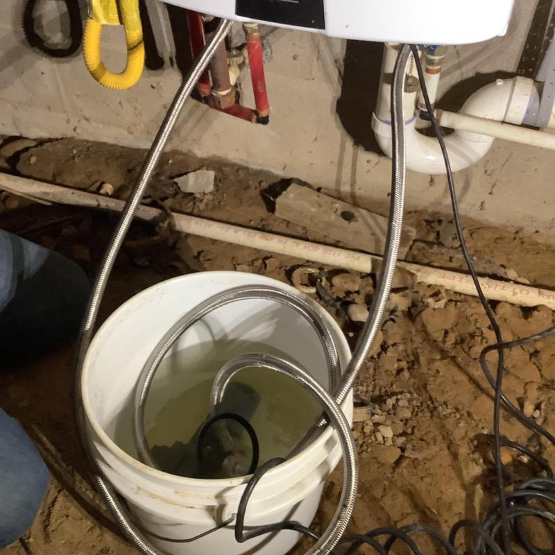 Navien tankless water heater maintenance setup with bucket Navien tankless water heater maintenance setup with bucket