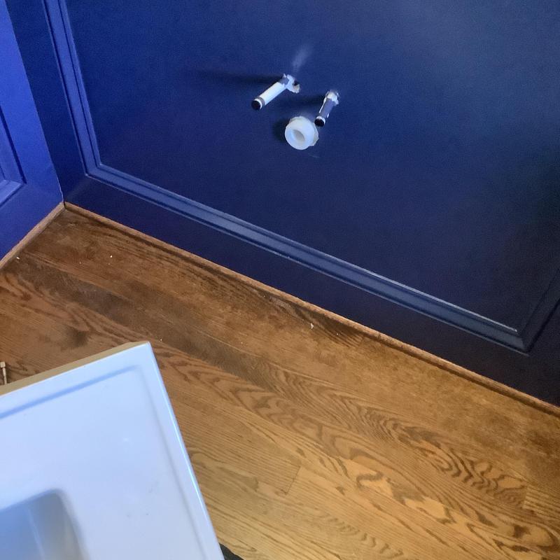 Pedestal sink water supply connections on blue wall Pedestal sink water supply connections on blue wall