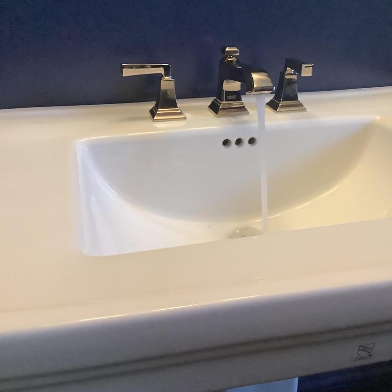 Pedestal sink and faucet installation with running water Pedestal sink and faucet installation with running water