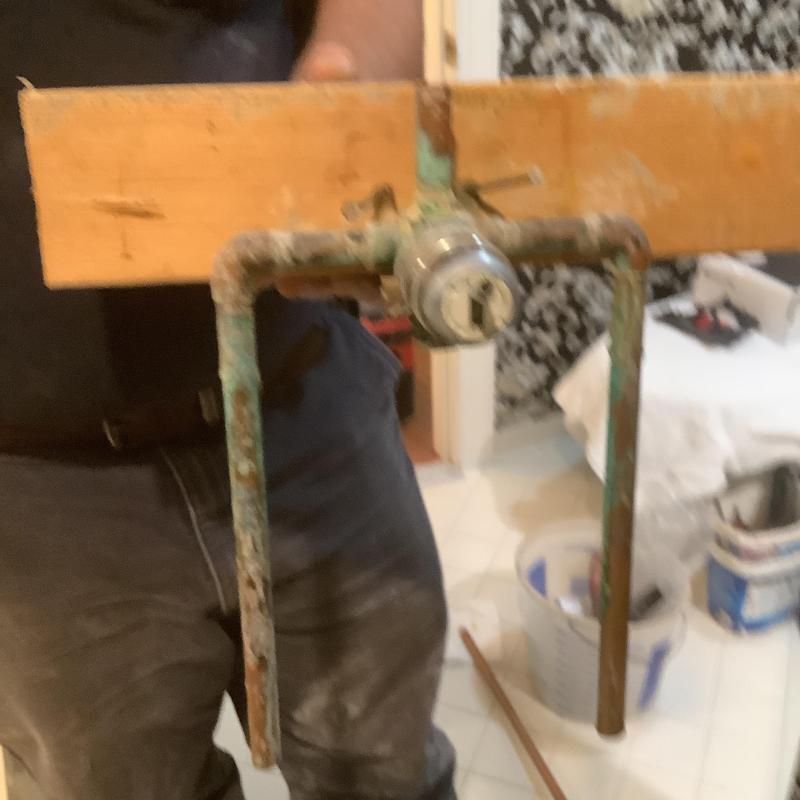 Shower valve with corroded copper piping in bathroom Shower valve with corroded copper piping in bathroom