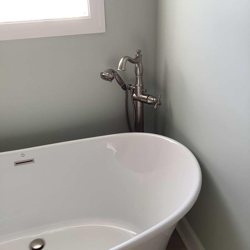 Freestanding tub with floor-mounted faucet and showerhead Freestanding tub with floor-mounted faucet and showerhead