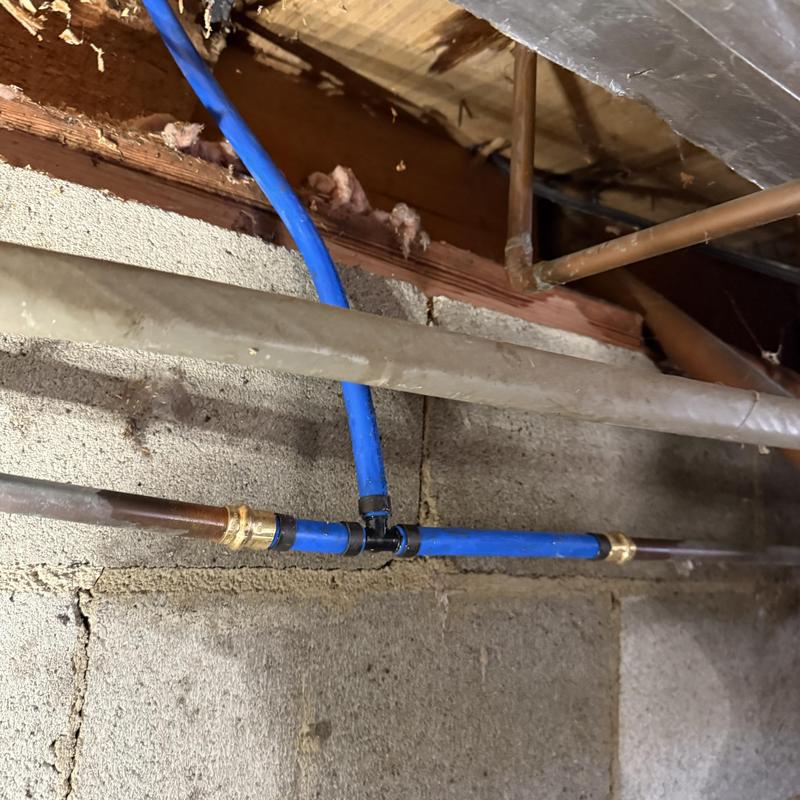 Ice maker water line with blue PEX piping installation Ice maker water line with blue PEX piping installation