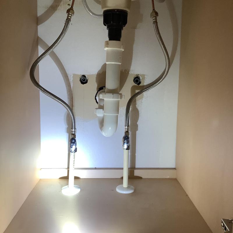 Vanity sink drain and supply lines installed under cabinet Vanity sink drain and supply lines installed under cabinet