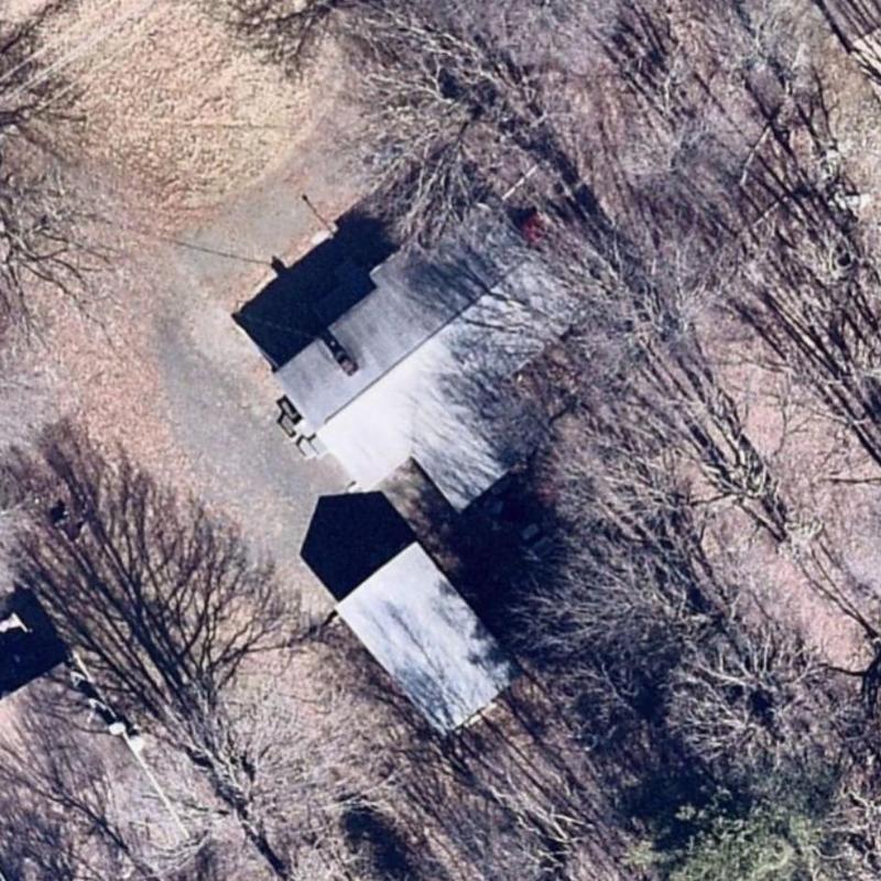 Residential roofs with surrounding trees aerial view Residential roofs with surrounding trees aerial view