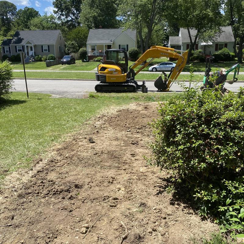 Sewer line excavation with mini excavator in residential yard Sewer line excavation with mini excavator in residential yard