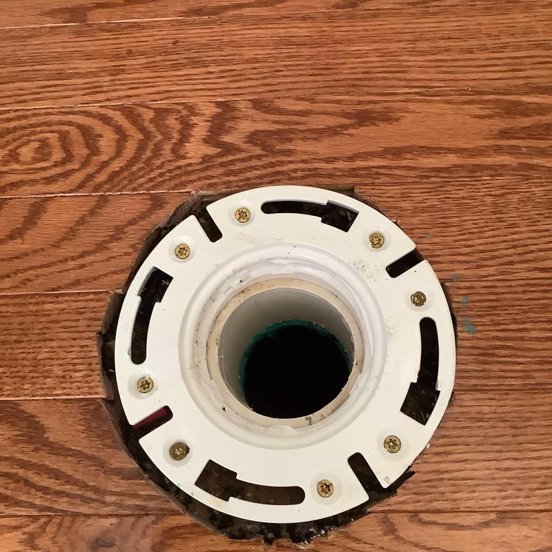 Toilet flange installation on hardwood floor cutout Toilet flange installation on hardwood floor cutout