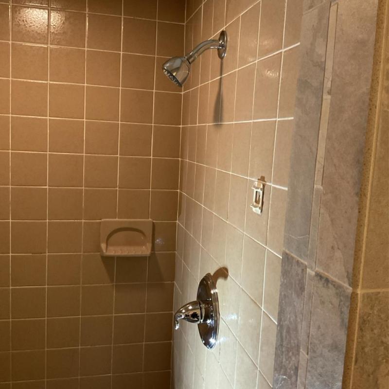 Shower diverter and trim installed in tiled shower Shower diverter and trim installed in tiled shower