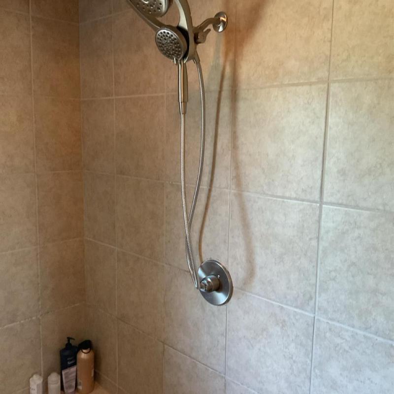 Delta tub and shower faucet trim with dual showerheads Delta tub and shower faucet trim with dual showerheads
