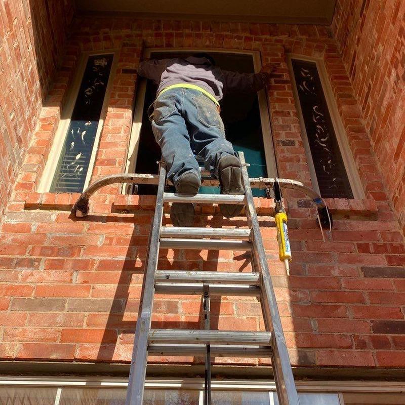 Vinyl window installation on brick home exterior Vinyl window installation on brick home exterior