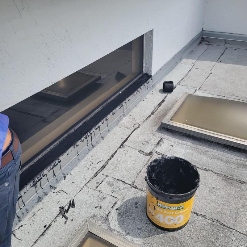 Flat roof membrane sealant with window flashing repairs Flat roof membrane sealant with window flashing repairs