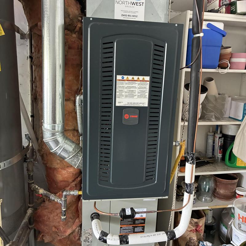 Trane furnace system with vent and piping in utility room Trane furnace system with vent and piping in utility room