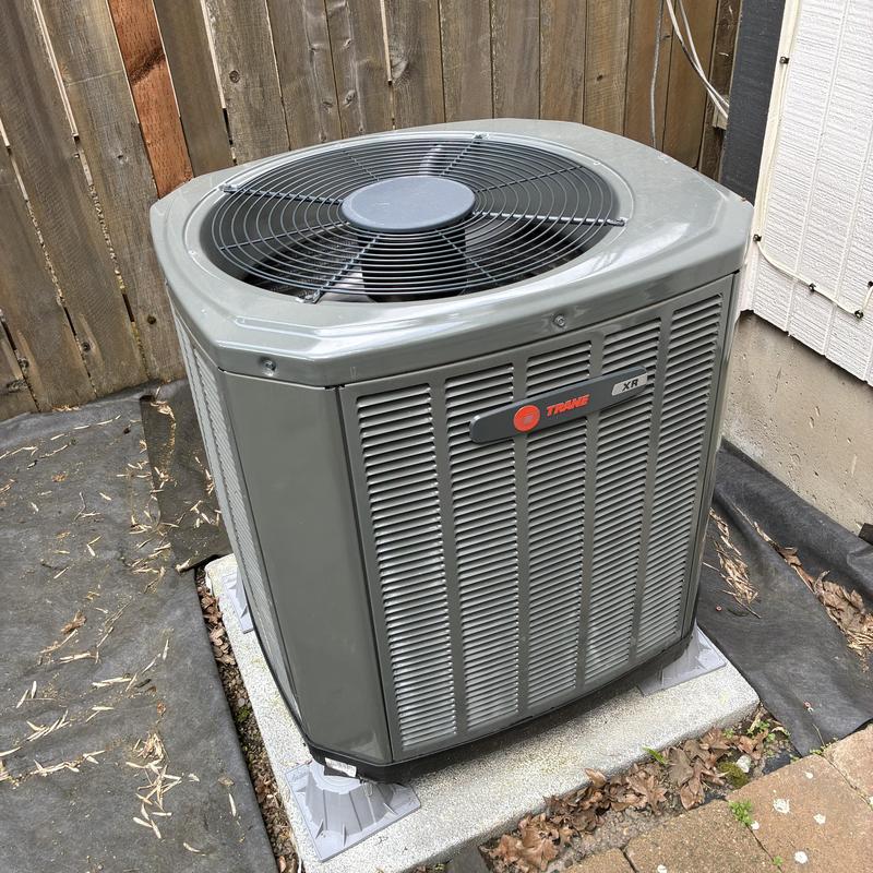 Trane XR outdoor air conditioning unit on concrete pad Trane XR outdoor air conditioning unit on concrete pad