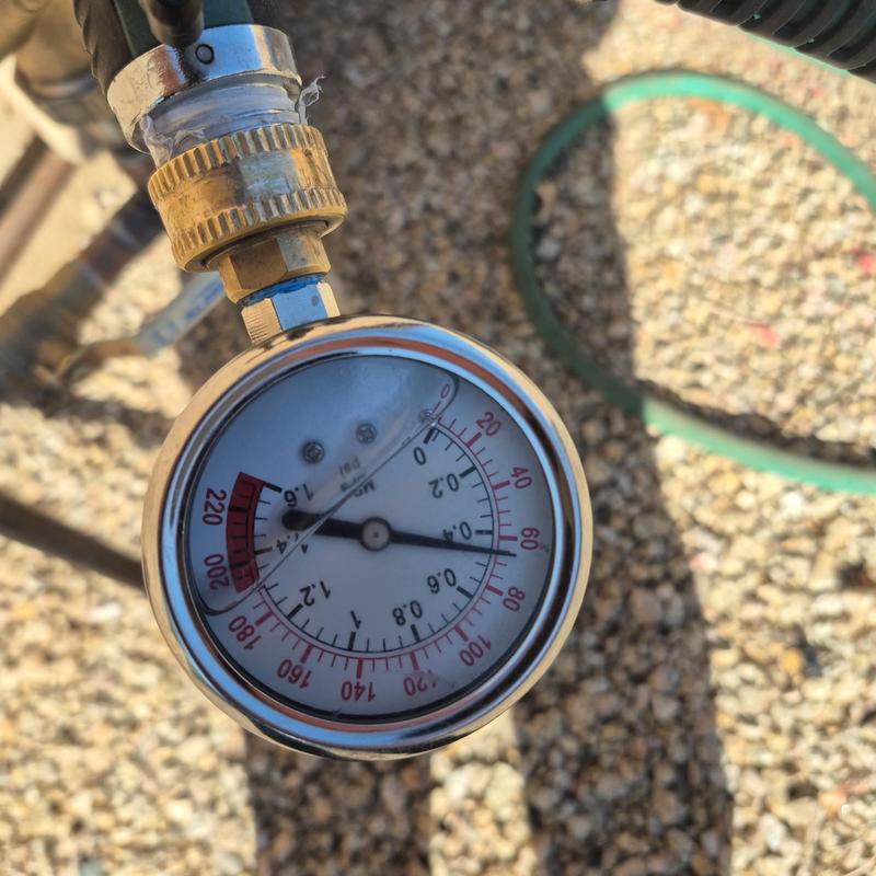 Pressure regulator valve gauge showing water pressure Pressure regulator valve gauge showing water pressure