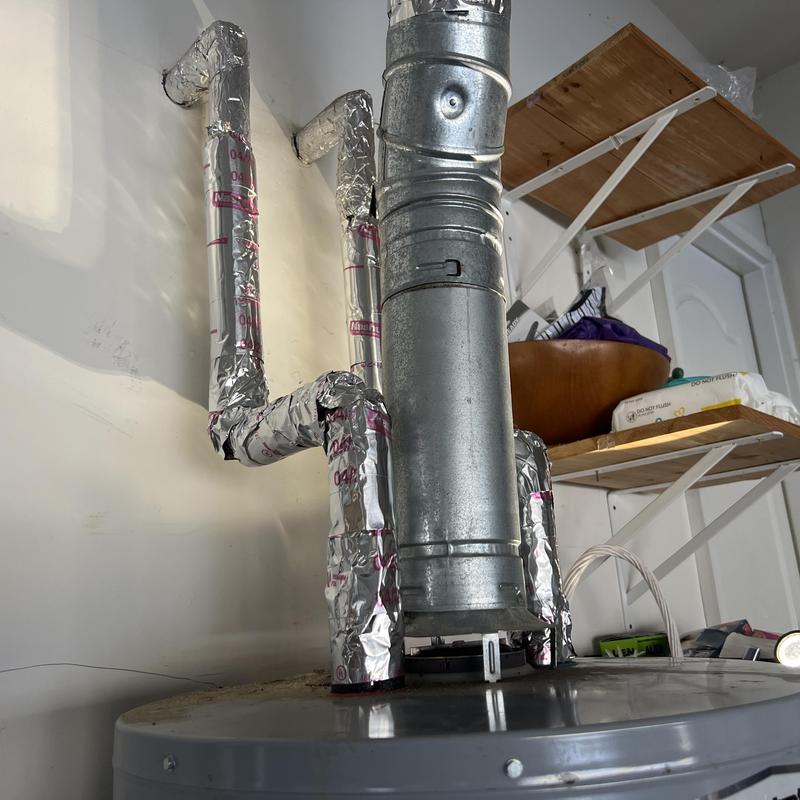 Natural gas water heater with insulated piping Natural gas water heater with insulated piping