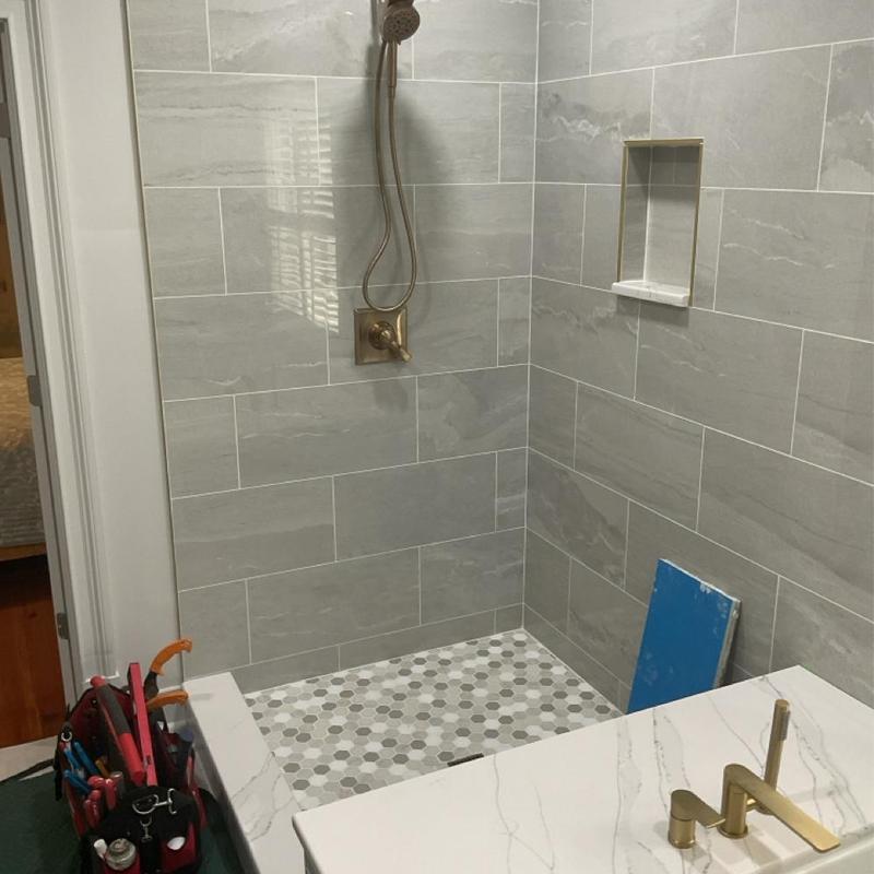 Shower plumbing and tile installation in bathroom remodel Shower plumbing and tile installation in bathroom remodel