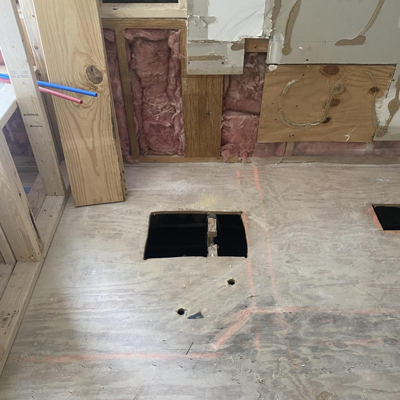 Bathroom floor cut for plumbing rough-in installation Bathroom floor cut for plumbing rough-in installation