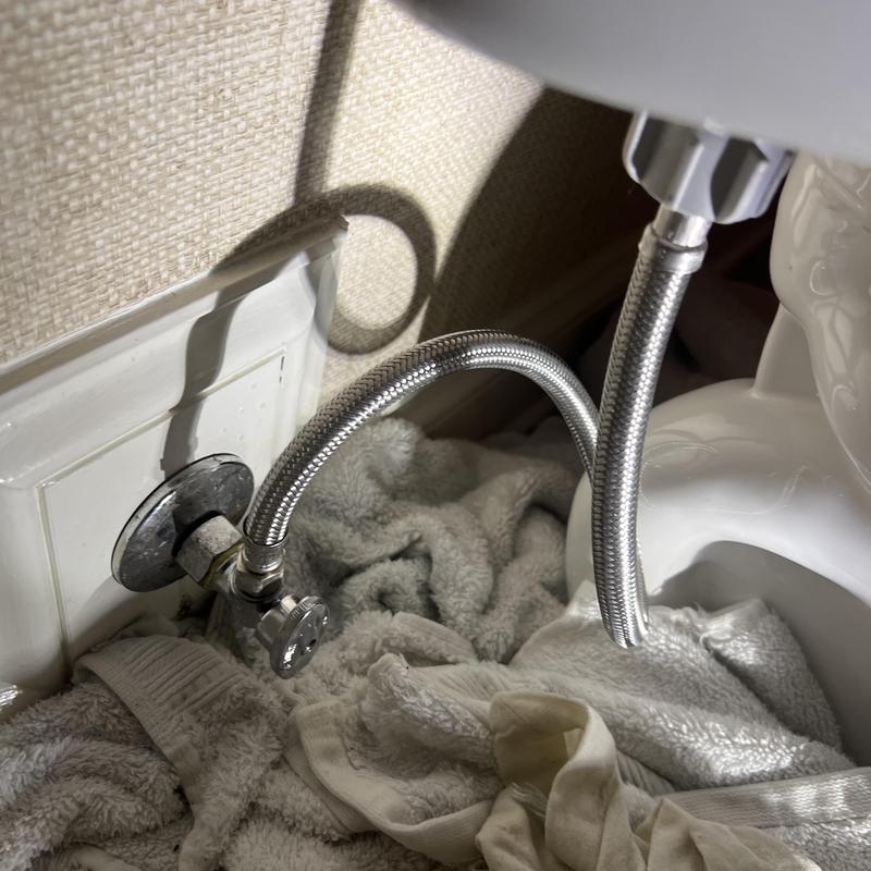 Toilet shut off valve and supply line in bathroom corner Toilet shut off valve and supply line in bathroom corner