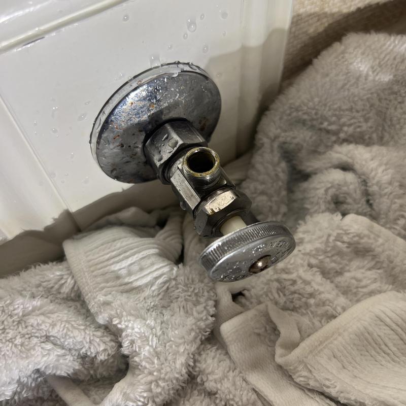 Toilet shut off valve with towels for leak repair Toilet shut off valve with towels for leak repair