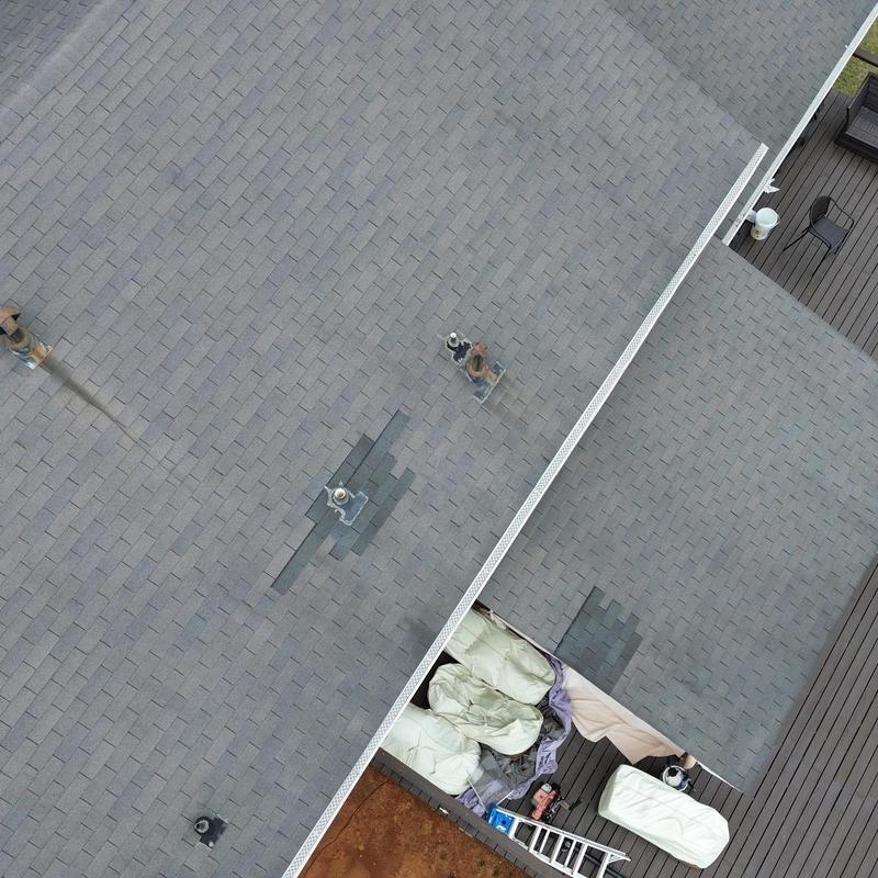 Architectural shingle roof with pipe boot flashing and gutters Architectural shingle roof with pipe boot flashing and gutters