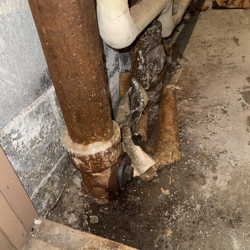 Main line cast iron pipe with corrosion and debris Main line cast iron pipe with corrosion and debris