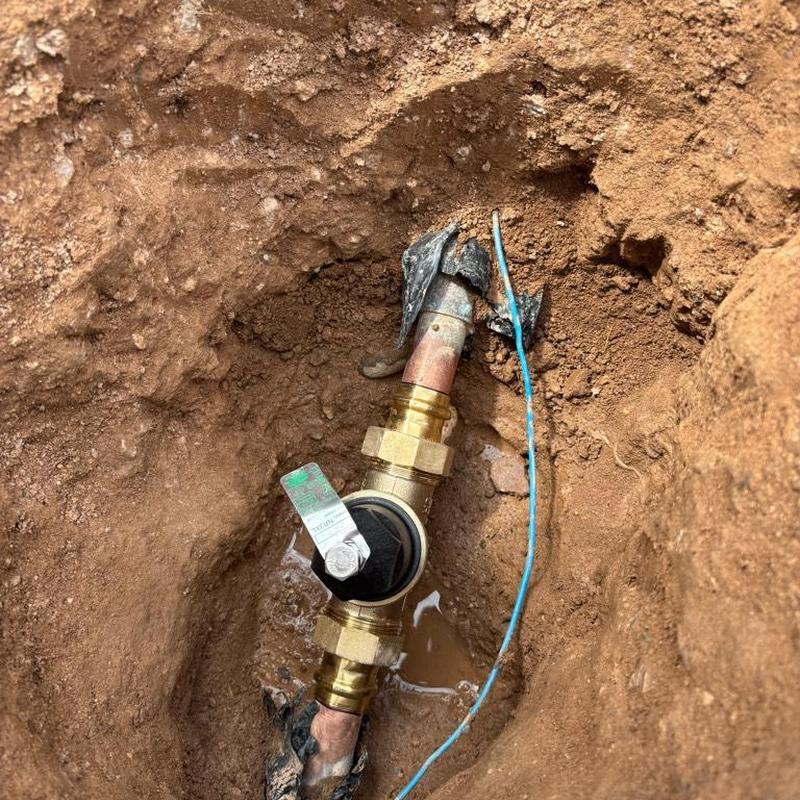 PRV installation on copper water main in dirt trench
