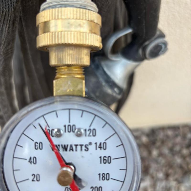 Pressure regulator valve gauge reading near water main