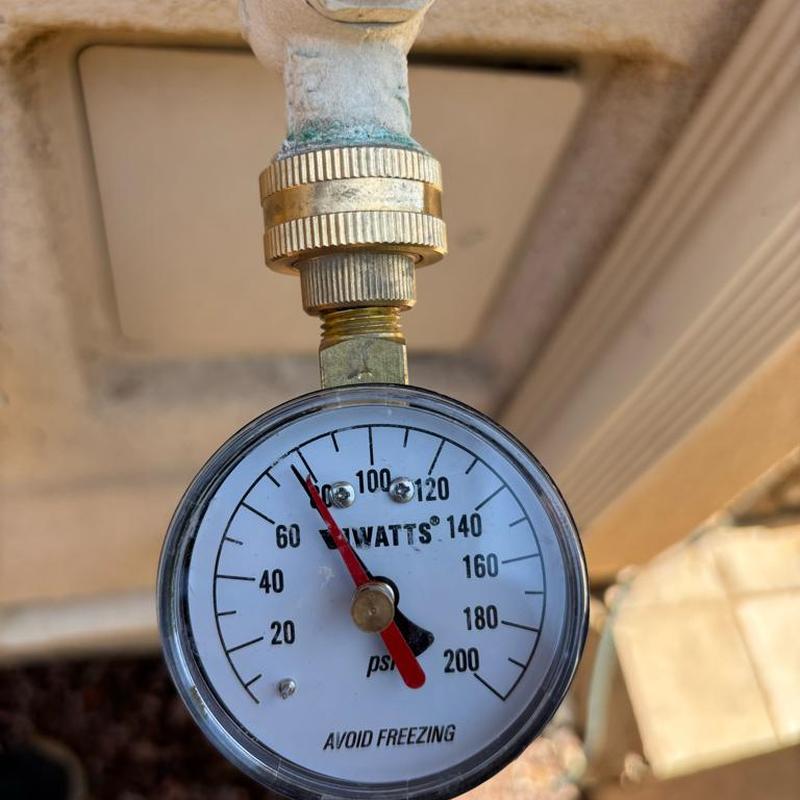 Pressure gauge on plumbing valve reading 75 psi