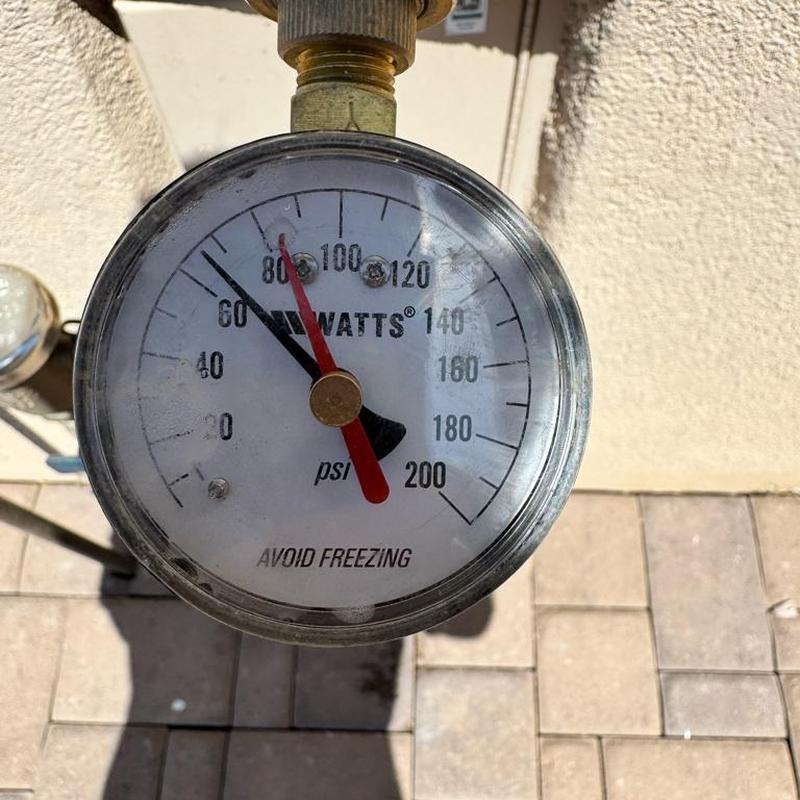 Pressure regulator valve with pressure gauge at water main