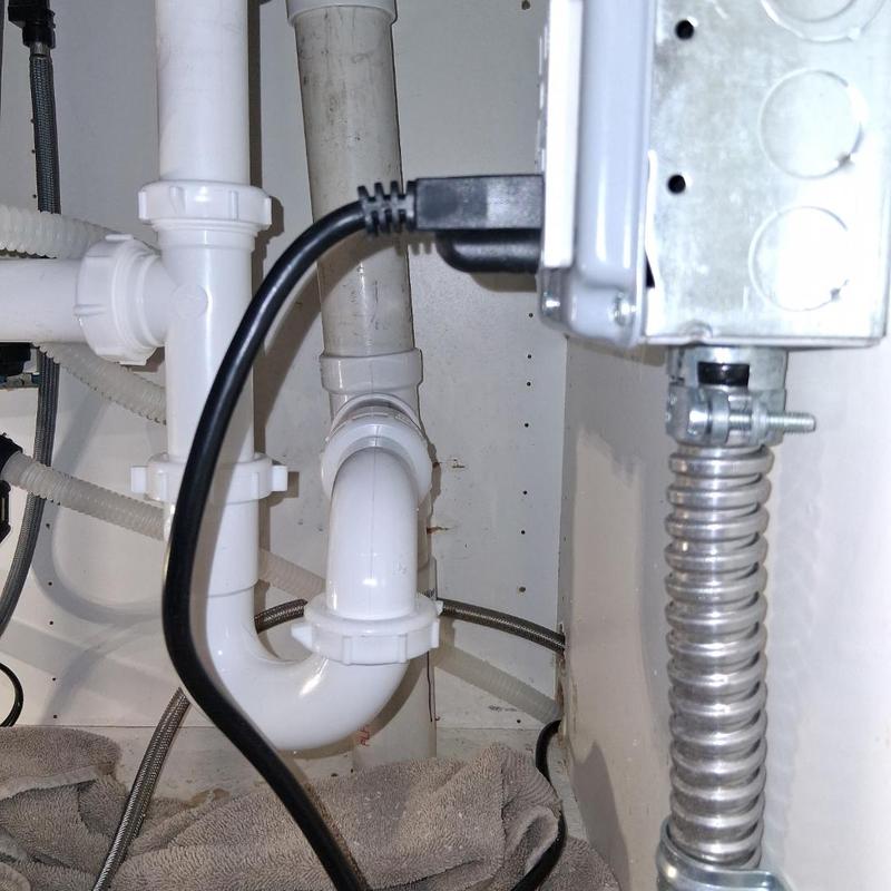 Under sink drain pipes with new PVC fittings installed