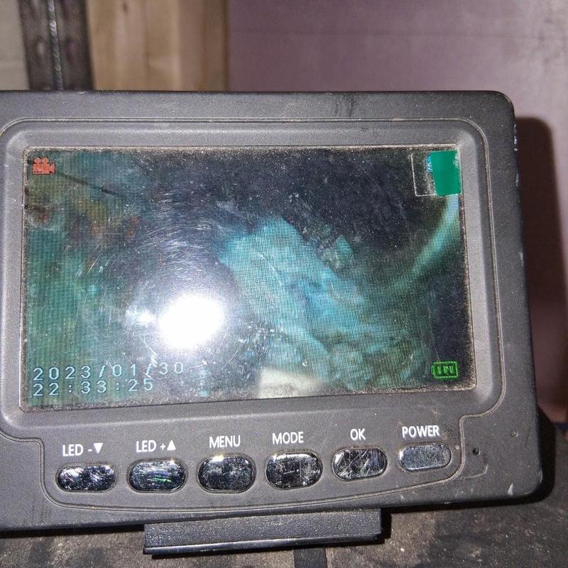 Drain inspection camera screen showing pipe interior