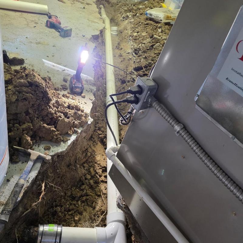 PVC laundry drain pipe replacement with concrete work