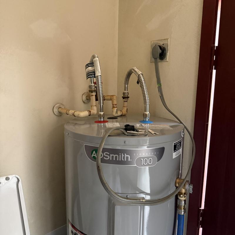 Water heater with new piping and electrical connection