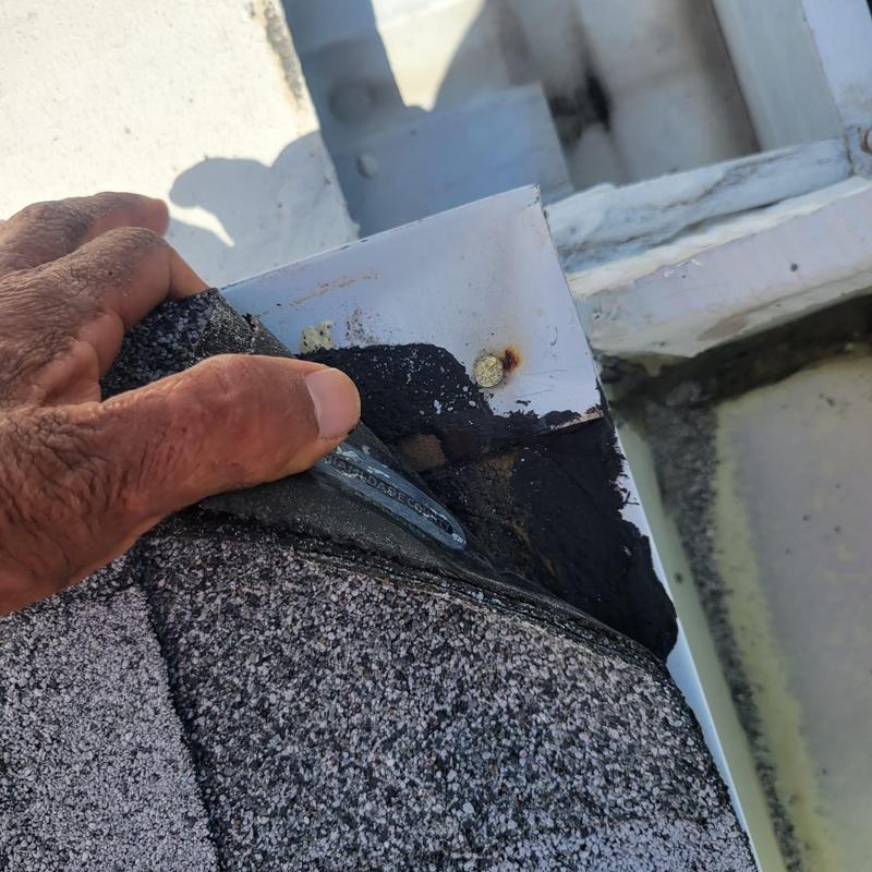 Skylight flashing showing improper roofing installation Skylight flashing showing improper roofing installation