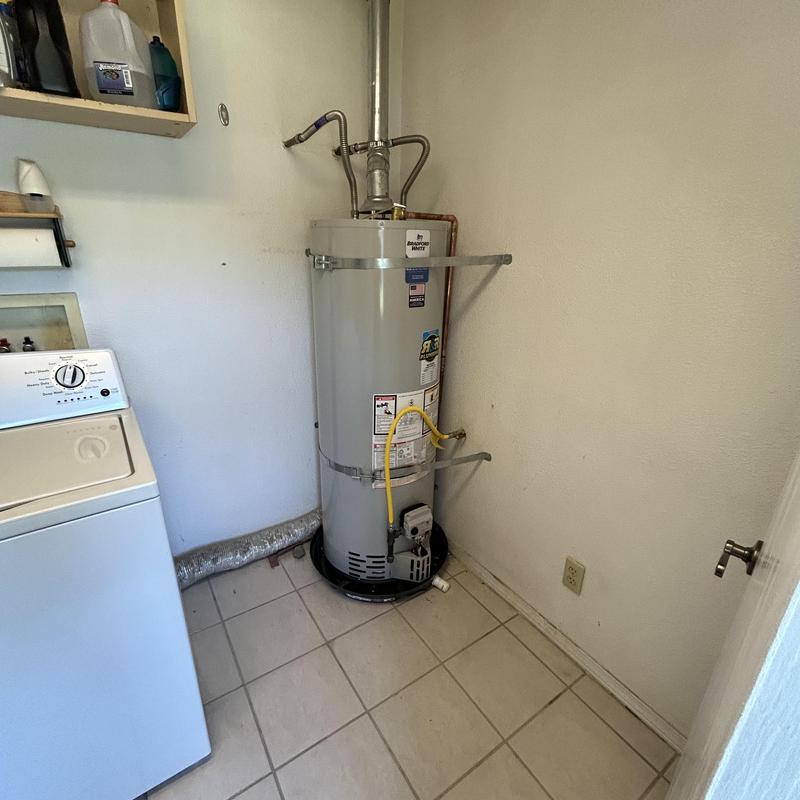 Bradford White water heater with new gas line and pan