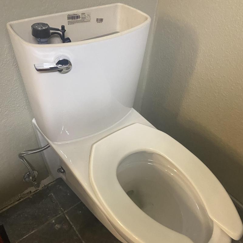 Toilet tank and bowl installation with new flush handle Toilet tank and bowl installation with new flush handle