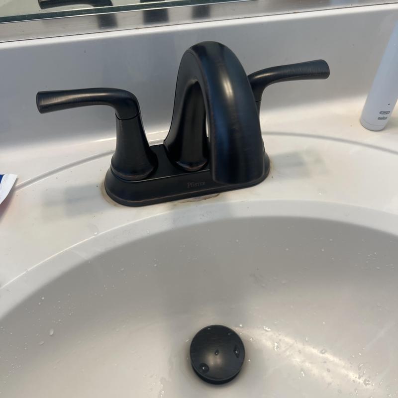 Vanity sink faucet with dual handles installed Vanity sink faucet with dual handles installed