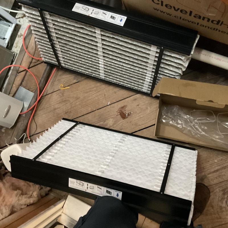 HVAC air filters ready for replacement on wood floor
