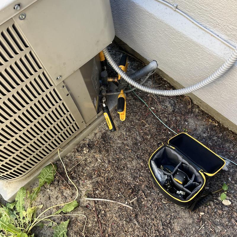 HVAC outdoor unit with inspection tools and bag HVAC outdoor unit with inspection tools and bag