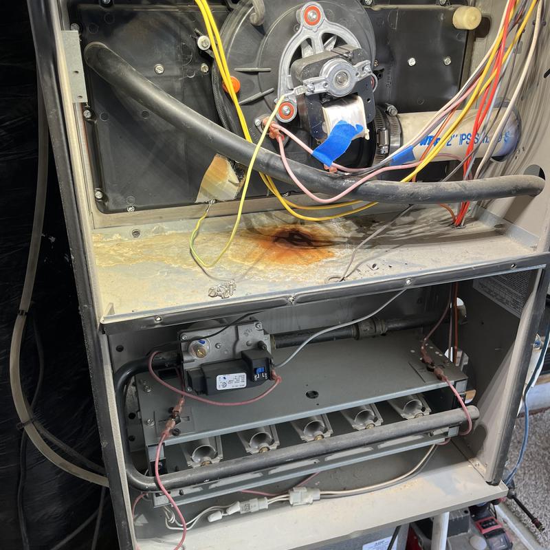 Gas furnace burner assembly with rust spot and wiring Gas furnace burner assembly with rust spot and wiring