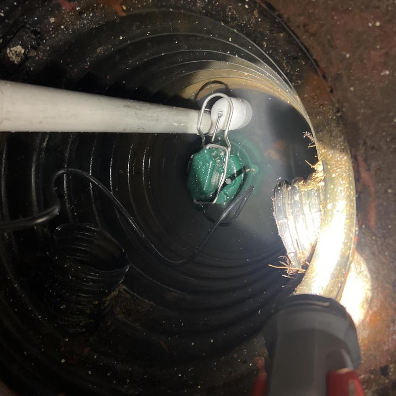 Zoeller sump pump inside wet sump basin with wiring