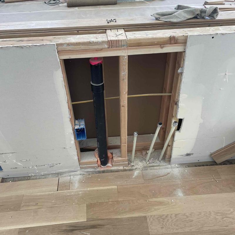 Drain pipe raised flush within wall framing