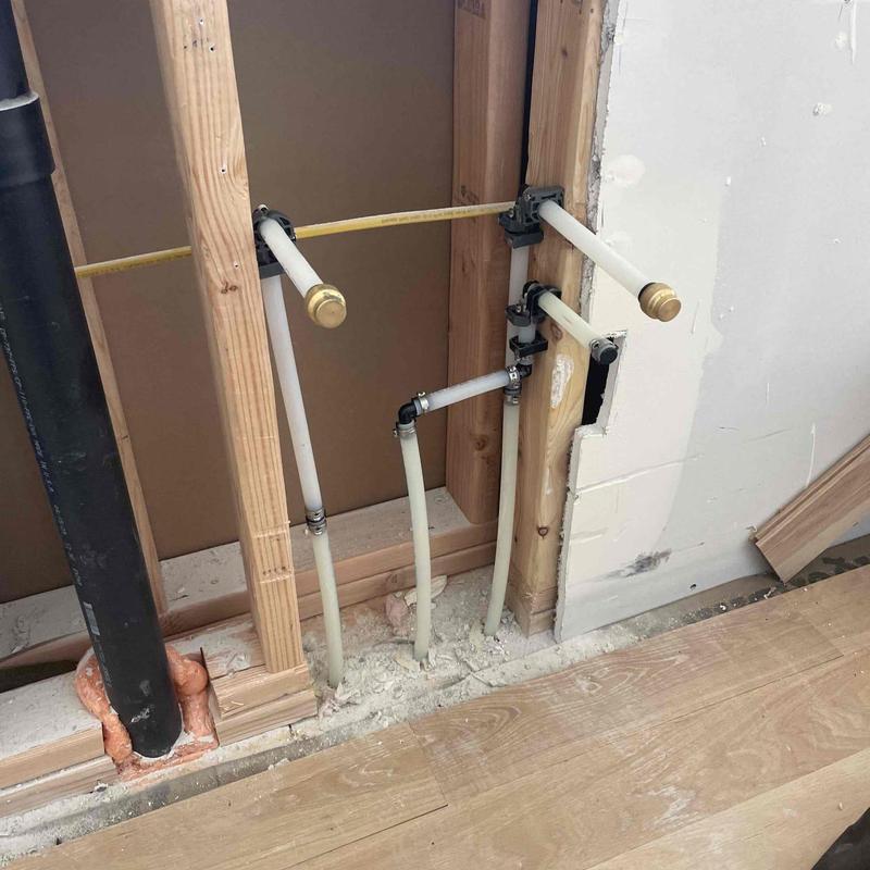 PEX plumbing lines installed in wall framing