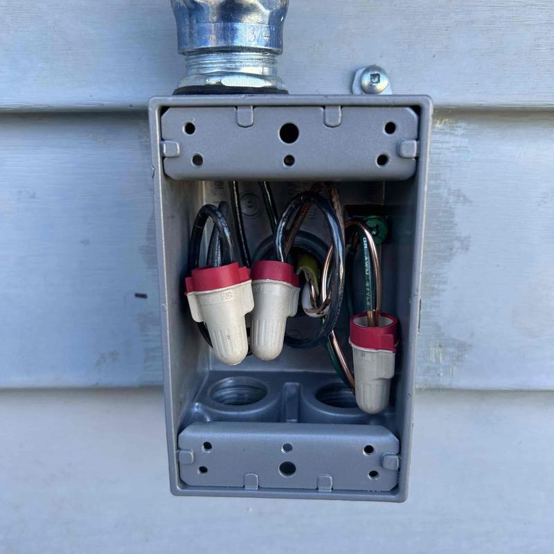 Electrical junction box with wire connectors and conduit