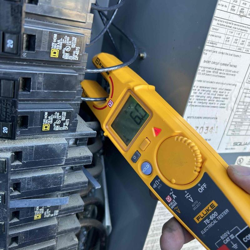 Electrical panel voltage testing with Fluke meter