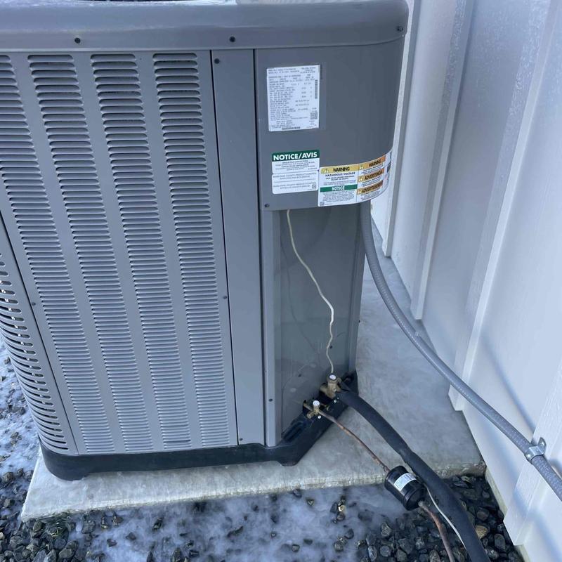 Air conditioner unit with recharge gauges attached outdoors Air conditioner unit with recharge gauges attached outdoors