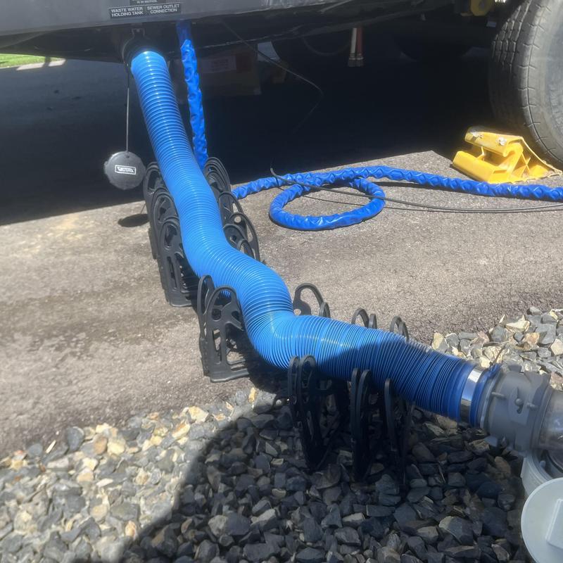 RV septic pump-out hose and specialty adapter setup