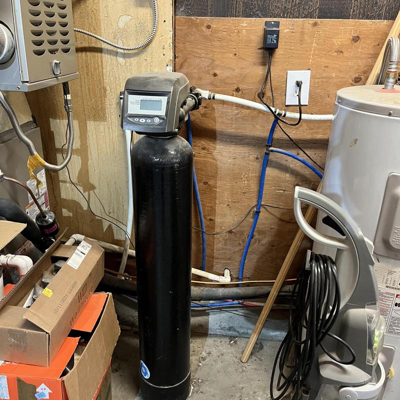 Water filtration system with control valve and pipes